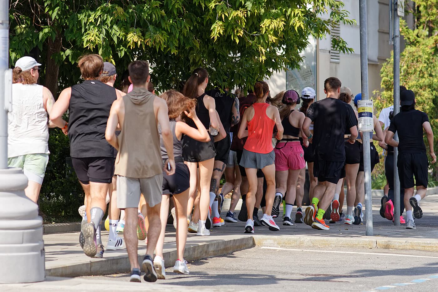 A group of people running together at an outdoor event